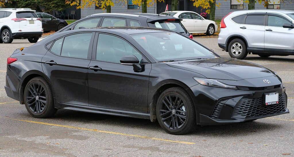 An image of Toyota Camry Hybrid 2025 midnight black best car for highway driving, fuel efficient, reliable and comfortable