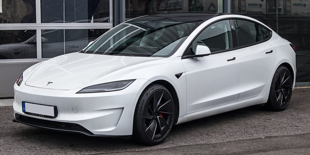 An Image of white Tesla Model 3 RWD. A Quiet and Comfortable Electric Car for Highway driving.